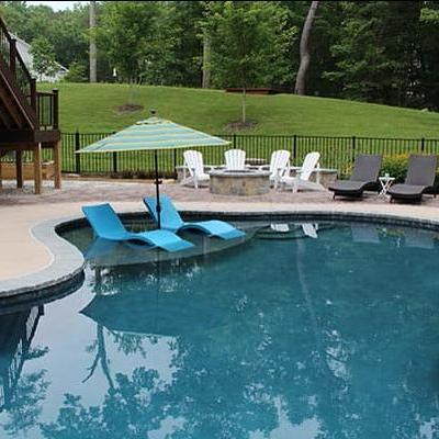 pool with lounge area and patio