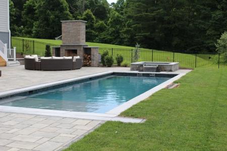 Beautiful Swimming Pool and Spa with a tanning shelf.