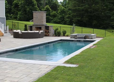 Beautiful Swimming Pool and Spa with a tanning shelf.