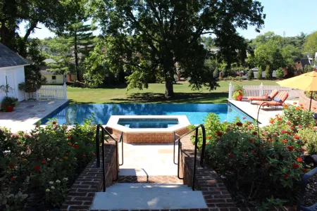 Garden steps leading to the raised brick spa and Federal Hill swimming pool