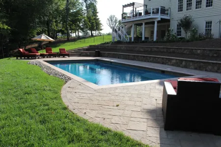 Stonehenge pool below terraced retaining walls in the Chantilly backyard