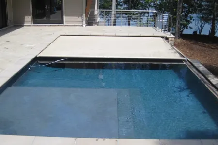 Lake Anna negative-edge pool with its automatic cover partly extended