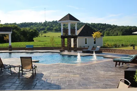 Unionville portfolio pool with beach-entry bubblers and surrounding paving