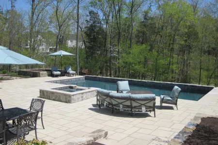 Old World Feel rectangular pool with detached raised spa and patio