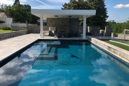 Haynes-Fredericksburg rectangular pool facing the covered outdoor seating area