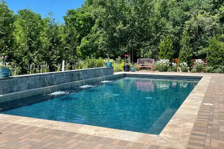 Lipman-Herndon pool with three waterfall outlets along a raised wall