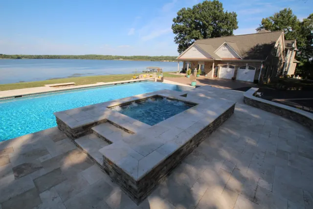 Raised spa beside the Thorny Point pool and waterfront patio