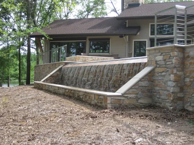 Water cascading over the stone-faced Lake Anna weir wall