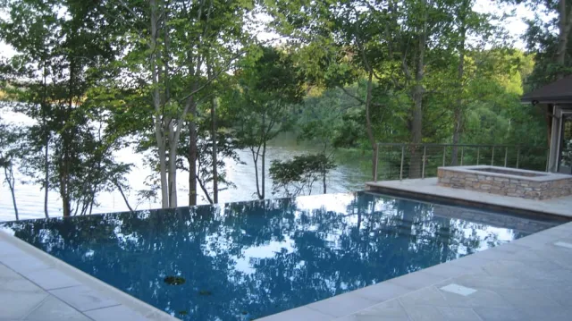 Lake Anna negative-edge pool with the lake visible through trees
