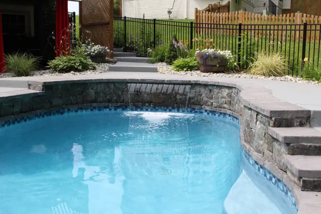 Triangle project waterfall beneath the raised pool edge