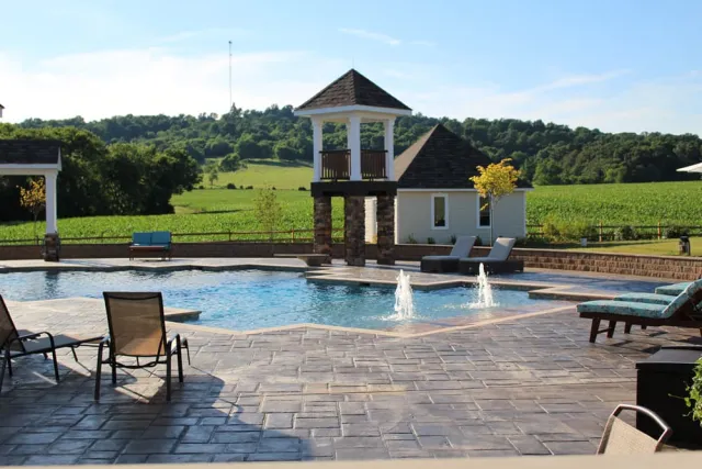Unionville portfolio pool with beach-entry bubblers and surrounding paving