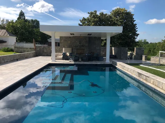 Haynes-Fredericksburg rectangular pool facing the covered outdoor seating area