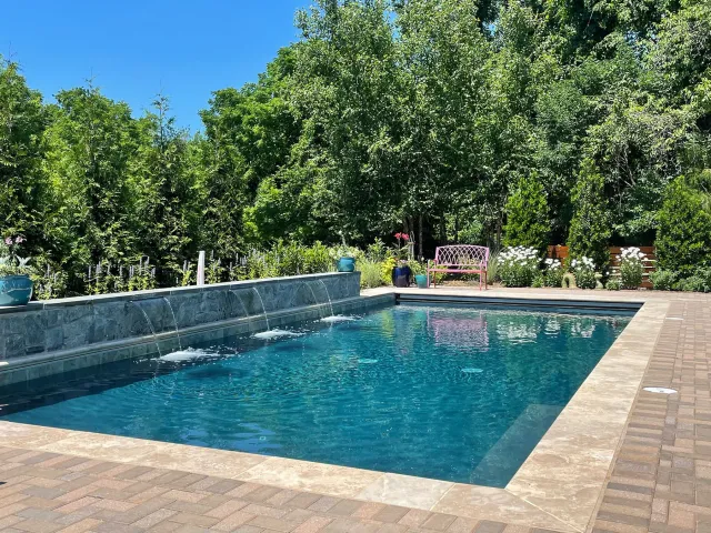 Lipman-Herndon pool with three waterfall outlets along a raised wall