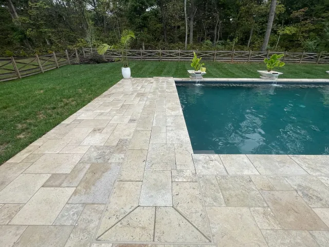 Patio paving and water features beside the Miller-Haymarket pool
